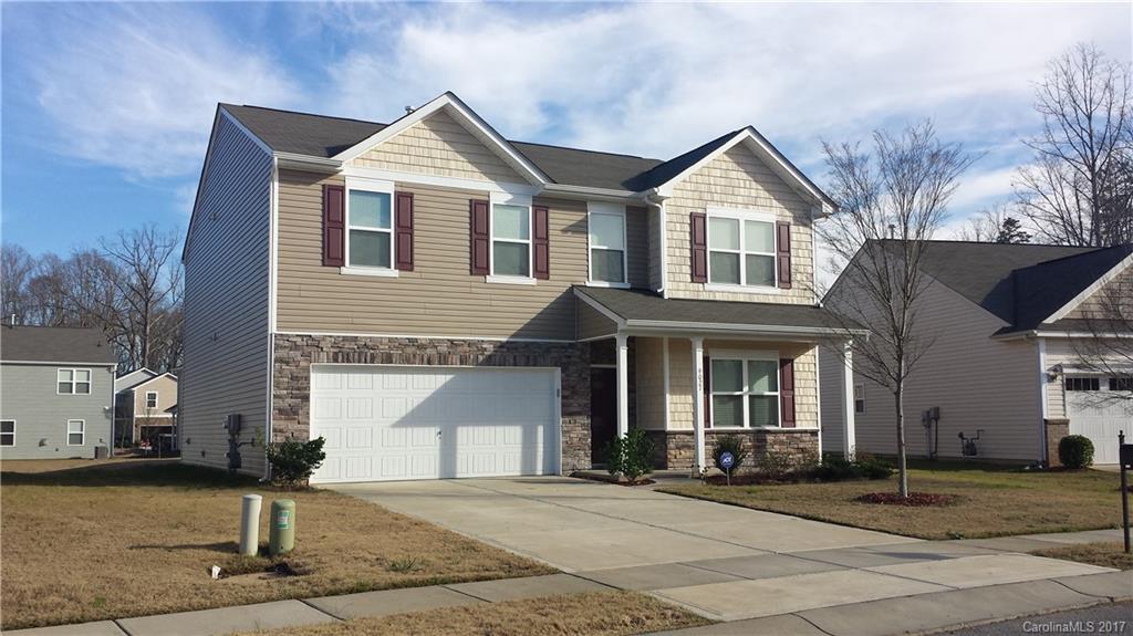 9027 Paddle Oak Road Charlotte, NC 28227 - Photo 14 of 22 a front view of a house with garden