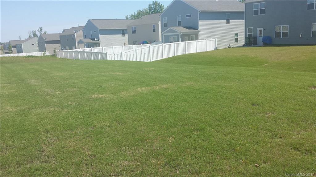 9027 Paddle Oak Road Charlotte, NC 28227 - Photo 15 of 22 a view of a house with a big yard