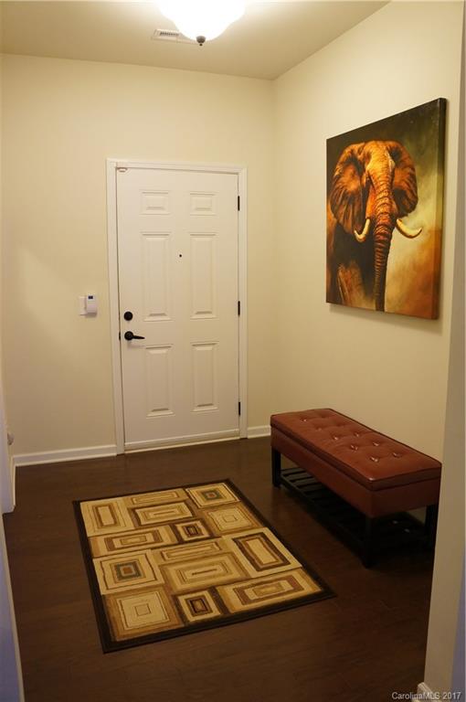 9027 Paddle Oak Road Charlotte, NC 28227 - Photo 5 of 22 a room with a bed and couch