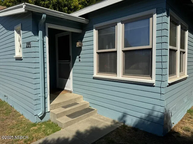 a view of house with window and wooden fence