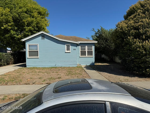 220 North F Street Lompoc, CA 93436 - Photo 4 of 15 a view of a house with snow on the road