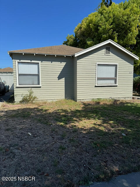 220 North F Street Lompoc, CA 93436 - Photo 7 of 15 a view of a house with a yard