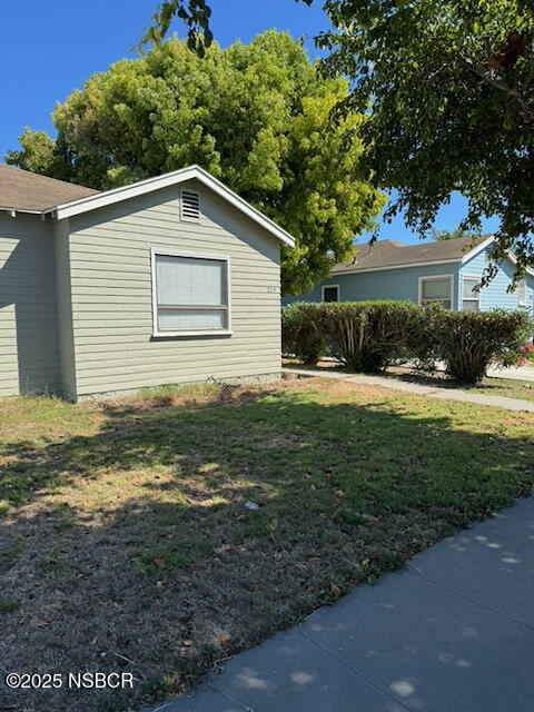 220 North F Street Lompoc, CA 93436 - Photo 8 of 15 a view of a yard with a house