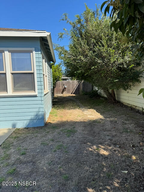 220 North F Street Lompoc, CA 93436 - Photo 9 of 15 a view of a house with a yard