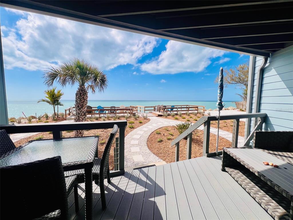 5030 North Beach Road, Unit 3 Englewood, FL 34223 - Photo 12 of 67 a view of a chairs and table on the roof deck