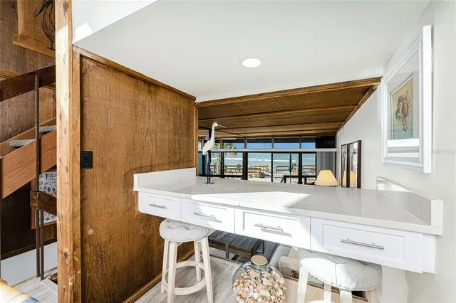 a kitchen with stainless steel appliances granite countertop a refrigerator sink and stove