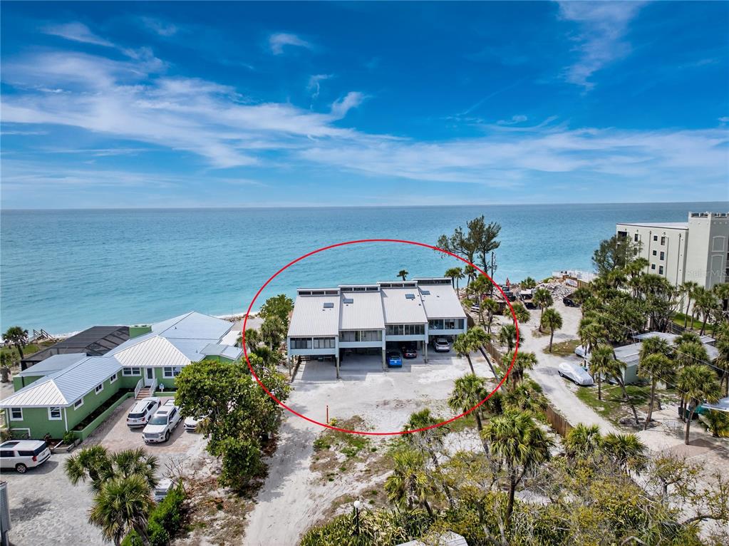 5030 North Beach Road, Unit 3 Englewood, FL 34223 - Photo 3 of 67 an aerial view of a house with a yard