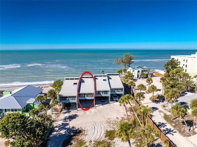 a view of a ocean with a nearby beach