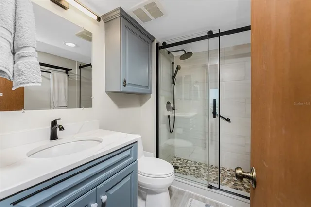 a living room with furniture and gym equipment