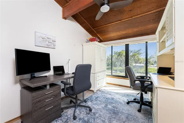 a view of a house with swimming pool and sitting area