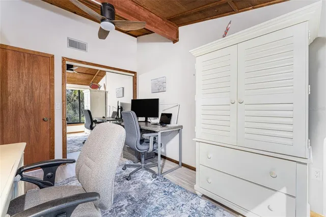 a view of building with car parked