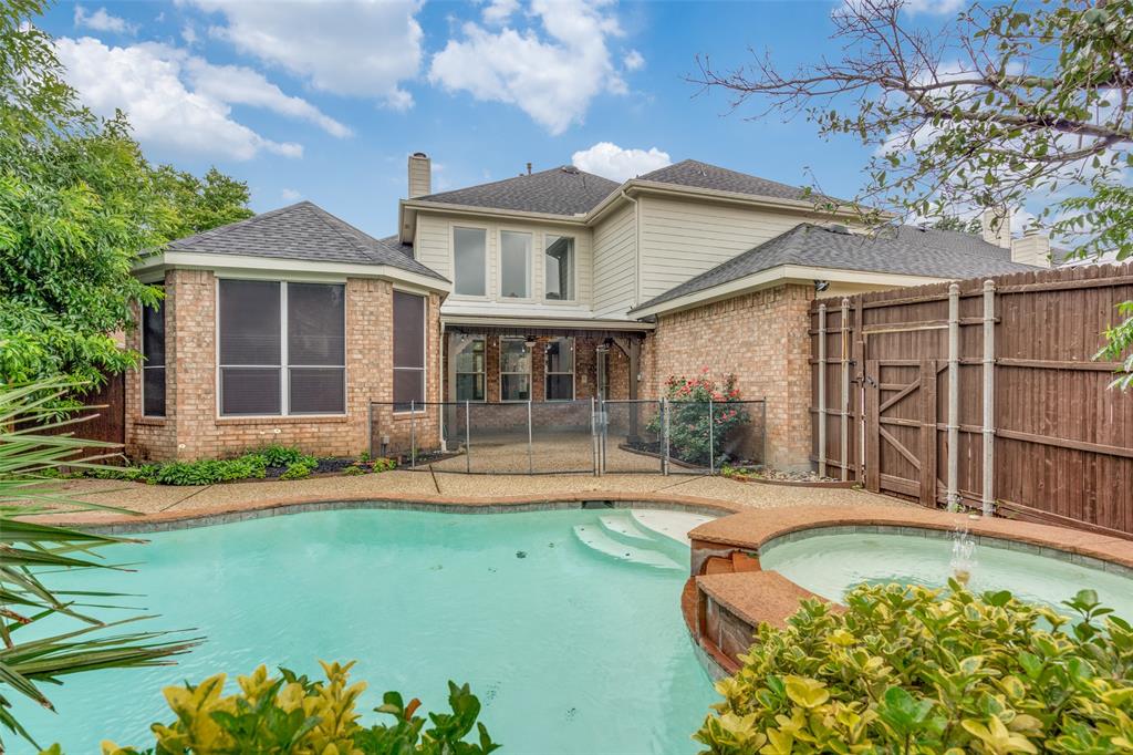 3421 Neiman Road Plano, TX 75025 - Photo 34 of 40 View of pool featuring a gate, a pool with connected hot tub, and a patio