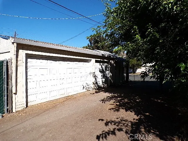 a view of a backyard of the house