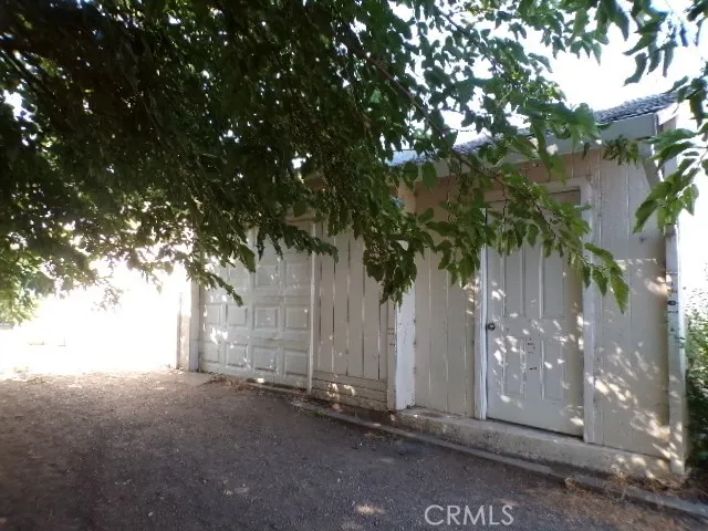 a view of a house with a tree