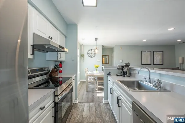 a kitchen that has a sink and a stove