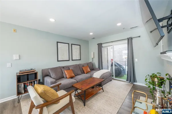 a living room with furniture and a rug