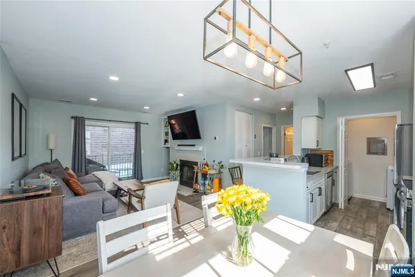 a living room with fireplace furniture and a flat screen tv