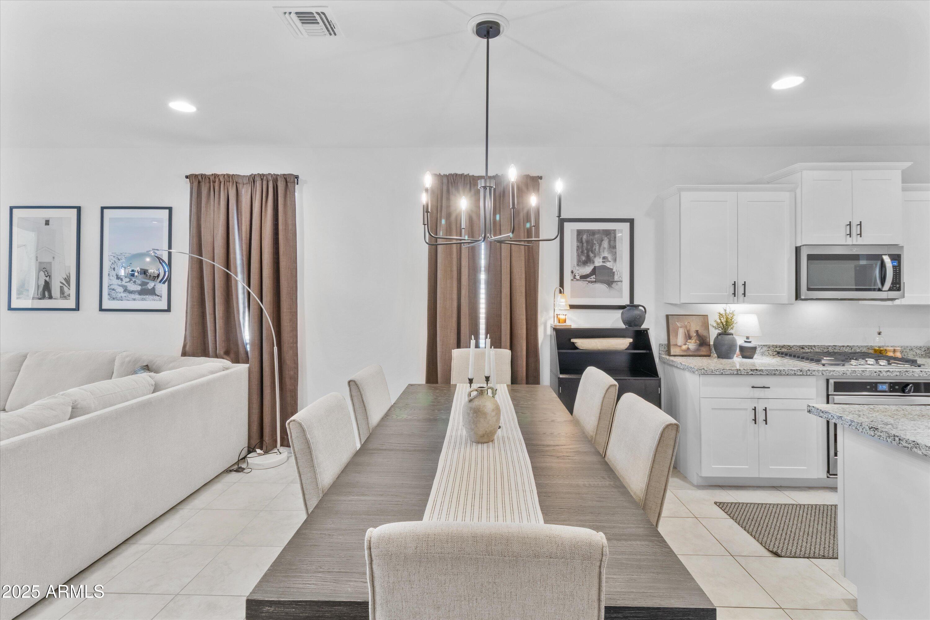 17970 West Pierson Street Goodyear, AZ 85395 - Photo 12 of 66 a dining room with furniture and chandelier