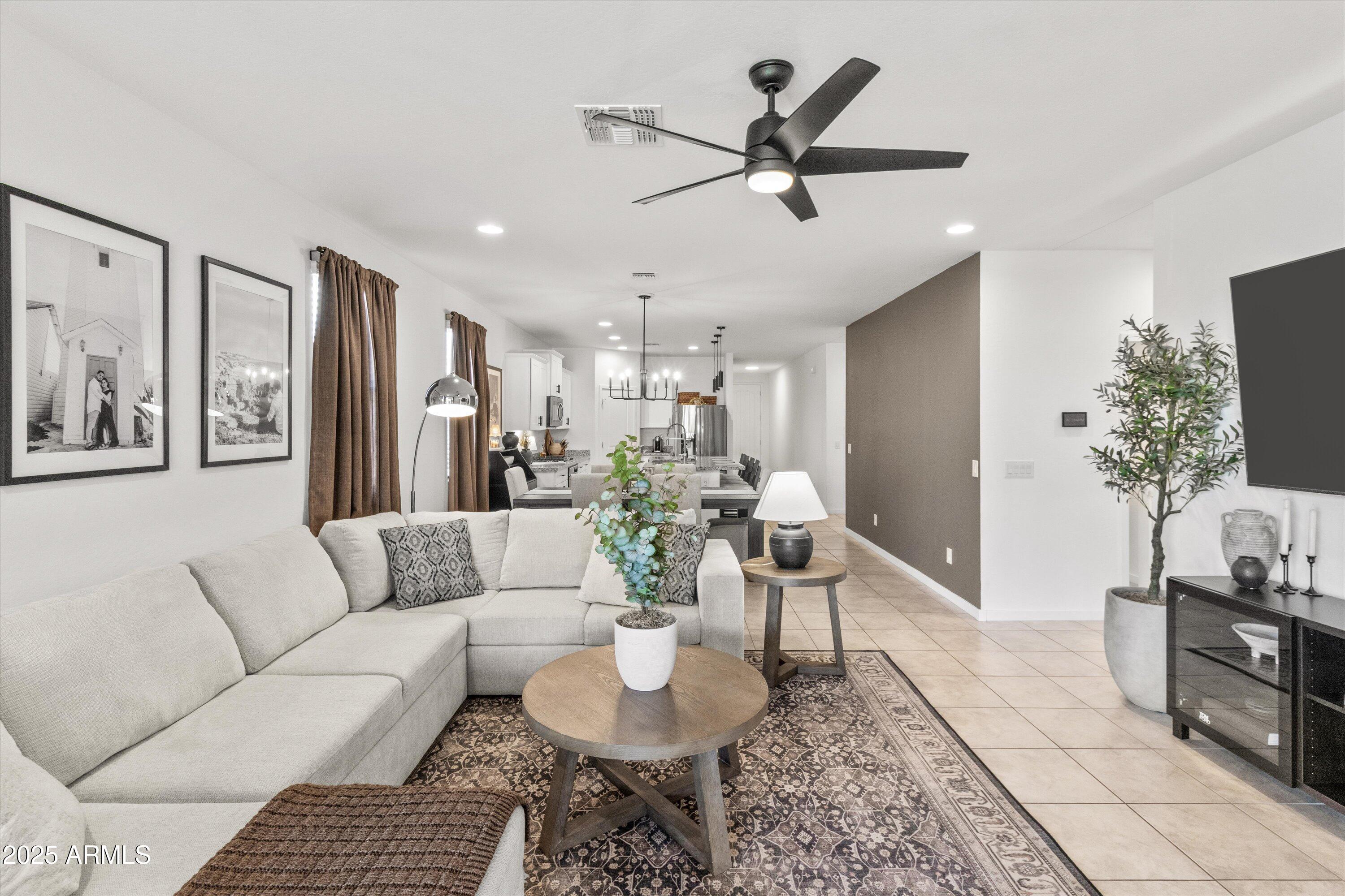 17970 West Pierson Street Goodyear, AZ 85395 - Photo 16 of 66 a living room with furniture and a chandelier