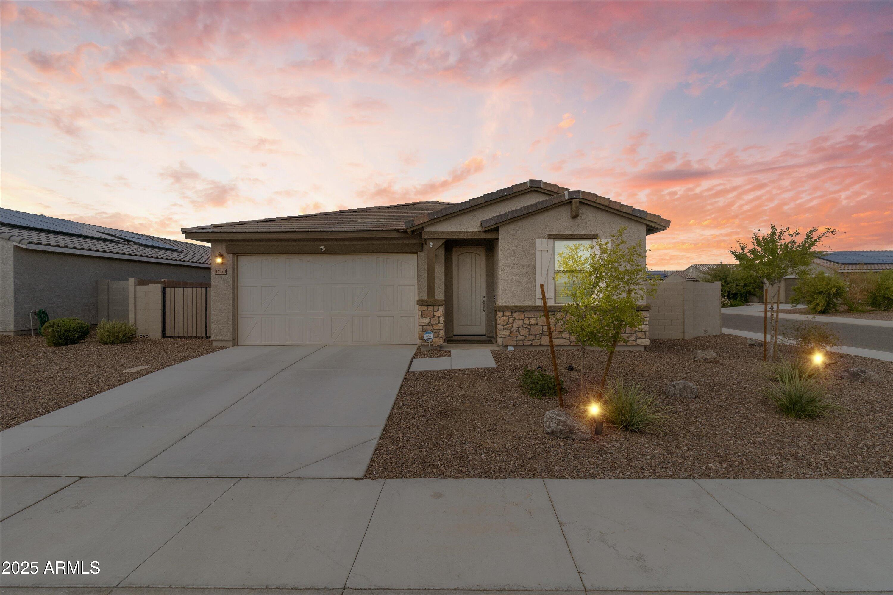 17970 West Pierson Street Goodyear, AZ 85395 - Photo 2 of 66 a front view of a house with yard