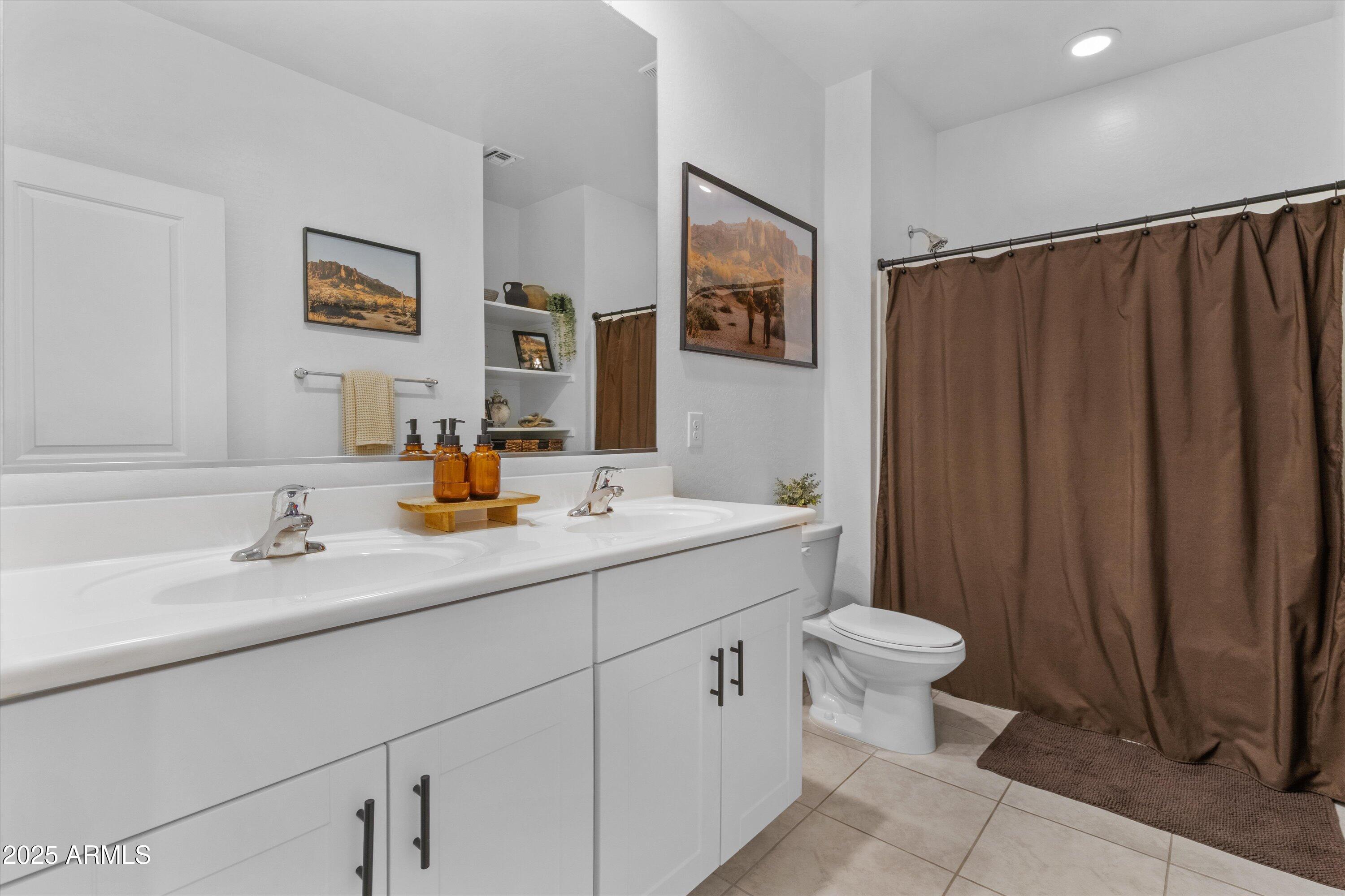 17970 West Pierson Street Goodyear, AZ 85395 - Photo 21 of 66 a bathroom with a sink and a mirror