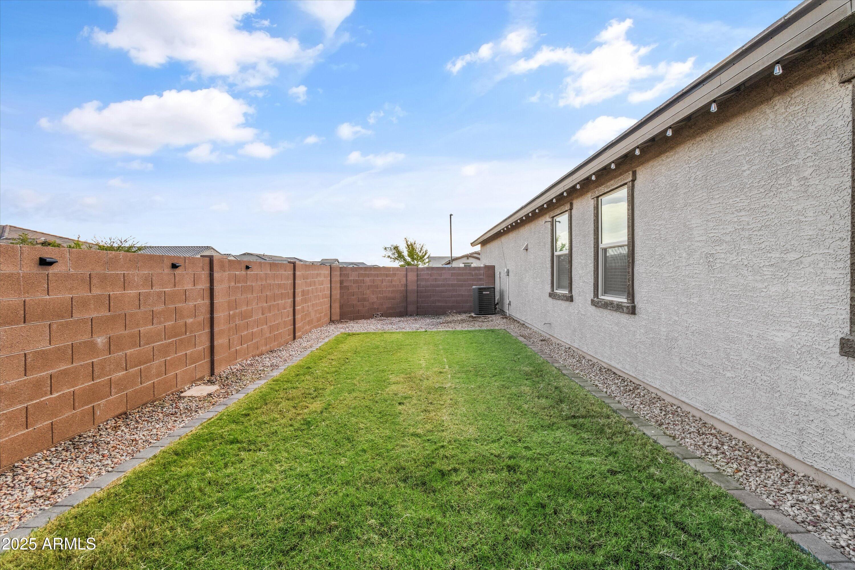 17970 West Pierson Street Goodyear, AZ 85395 - Photo 37 of 66 a view of backyard with pathway