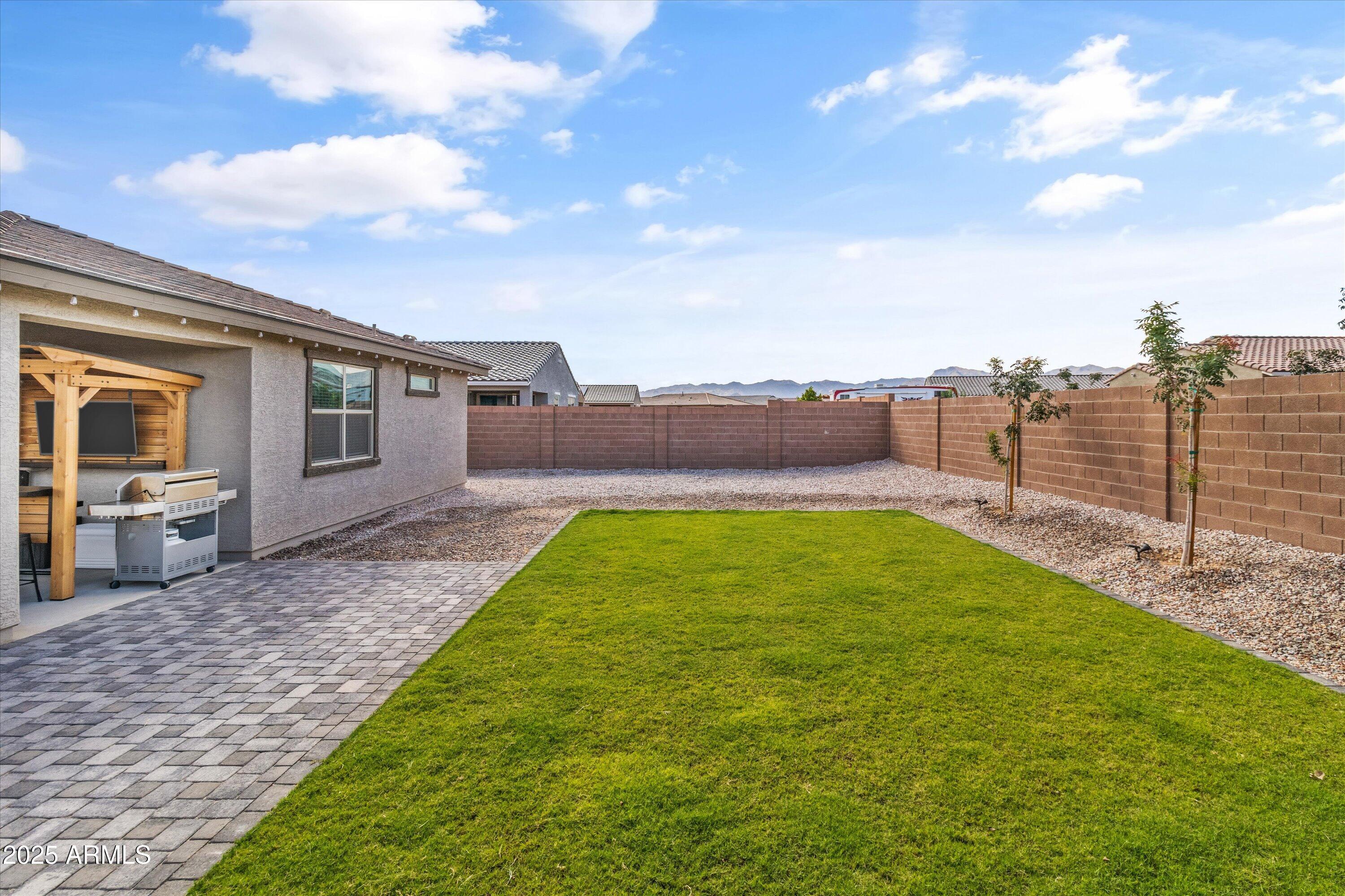 17970 West Pierson Street Goodyear, AZ 85395 - Photo 38 of 66 a view of a backyard with a garden