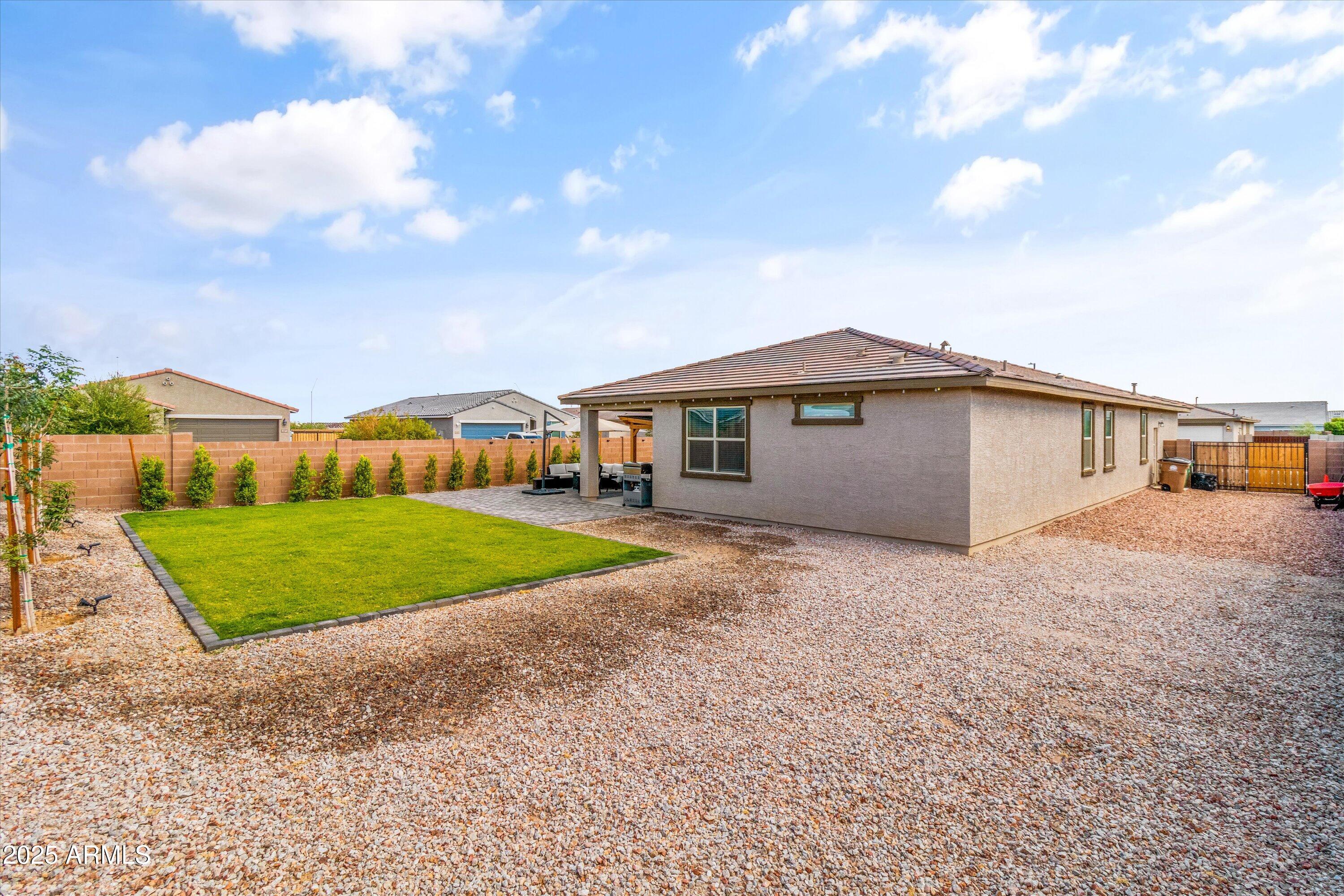 17970 West Pierson Street Goodyear, AZ 85395 - Photo 40 of 66 a view of an house with backyard and garden
