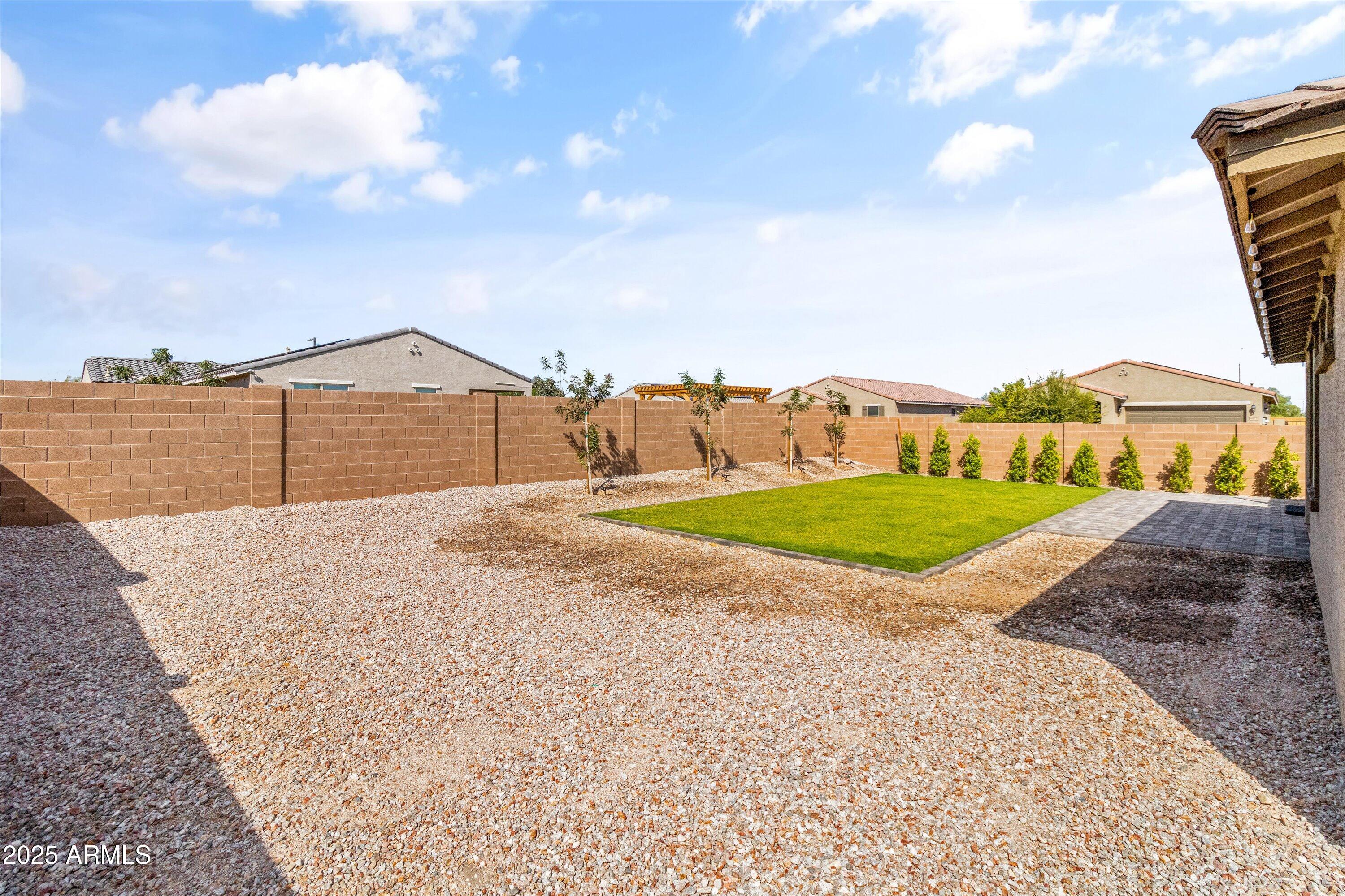 17970 West Pierson Street Goodyear, AZ 85395 - Photo 42 of 66 a view of a backyard with a garden