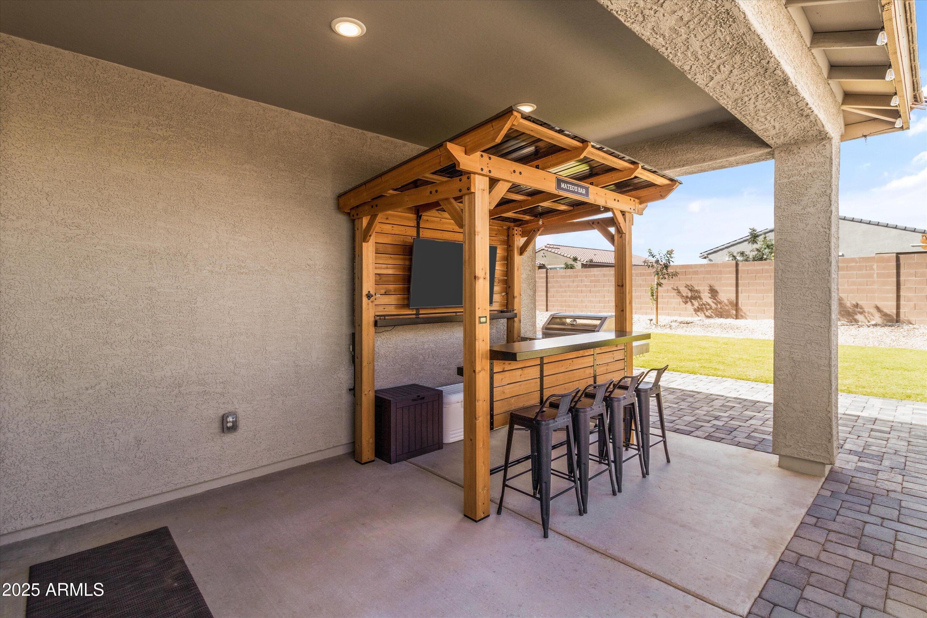 17970 West Pierson Street Goodyear, AZ 85395 - Photo 43 of 66 a view of a room with chairs next to a yard