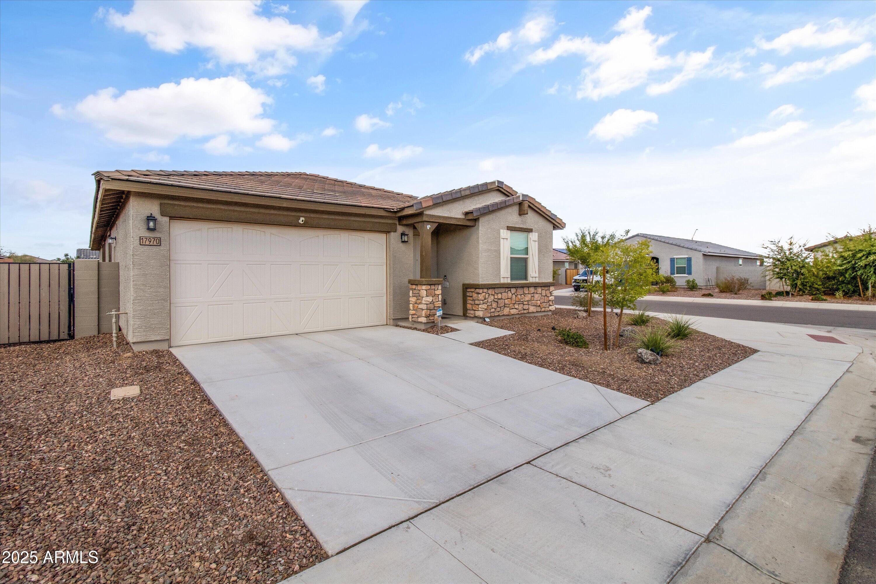 17970 West Pierson Street Goodyear, AZ 85395 - Photo 51 of 66 a backyard of a house with table and chairs