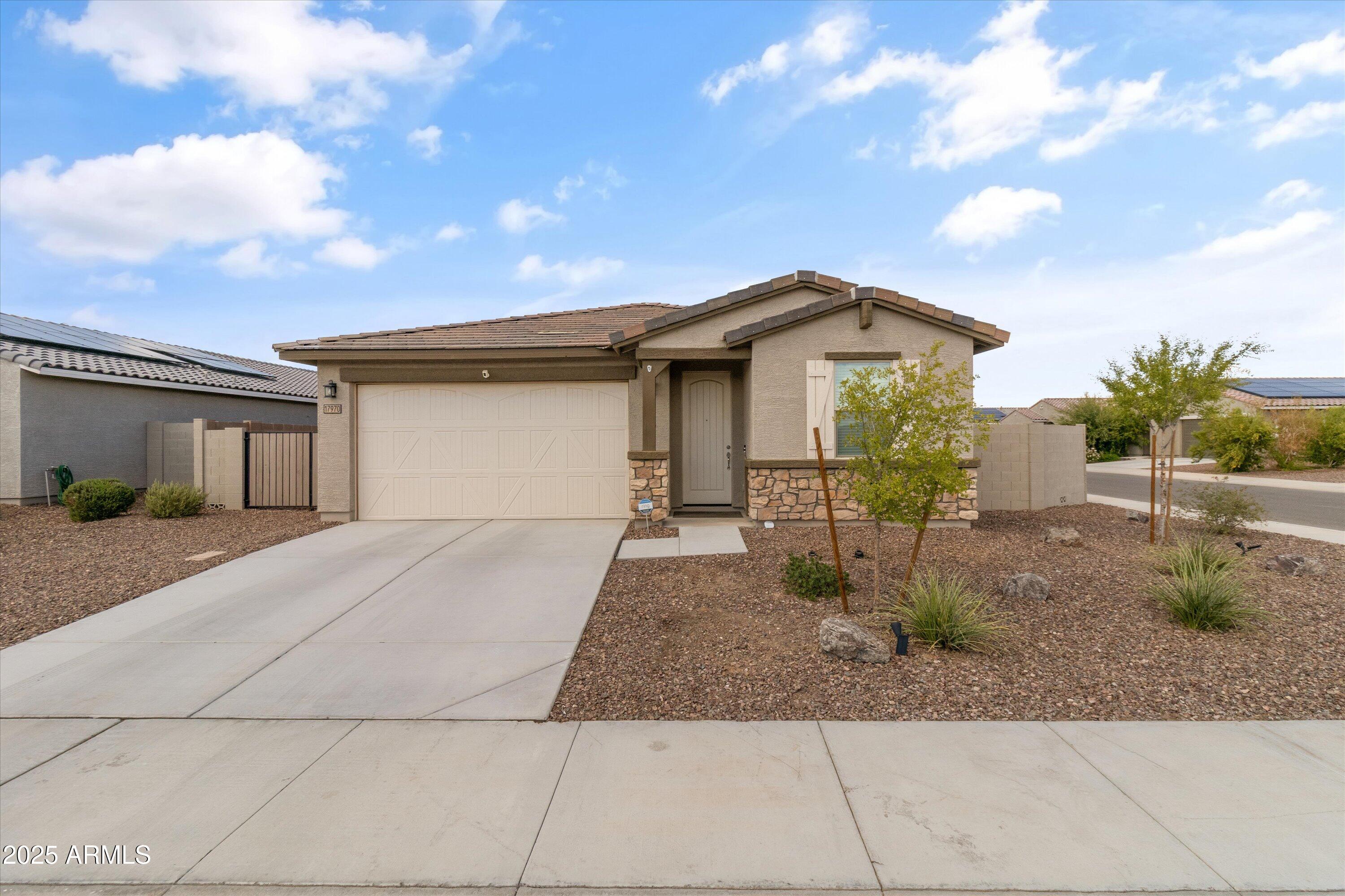 17970 West Pierson Street Goodyear, AZ 85395 - Photo 58 of 66 a front view of a house with garden