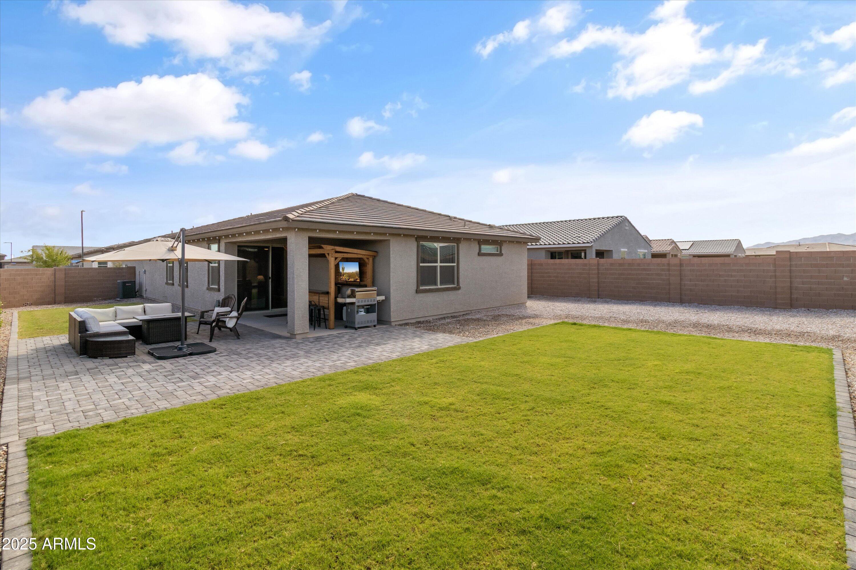 17970 West Pierson Street Goodyear, AZ 85395 - Photo 59 of 66 a view of swimming pool with lawn chairs and potted plants