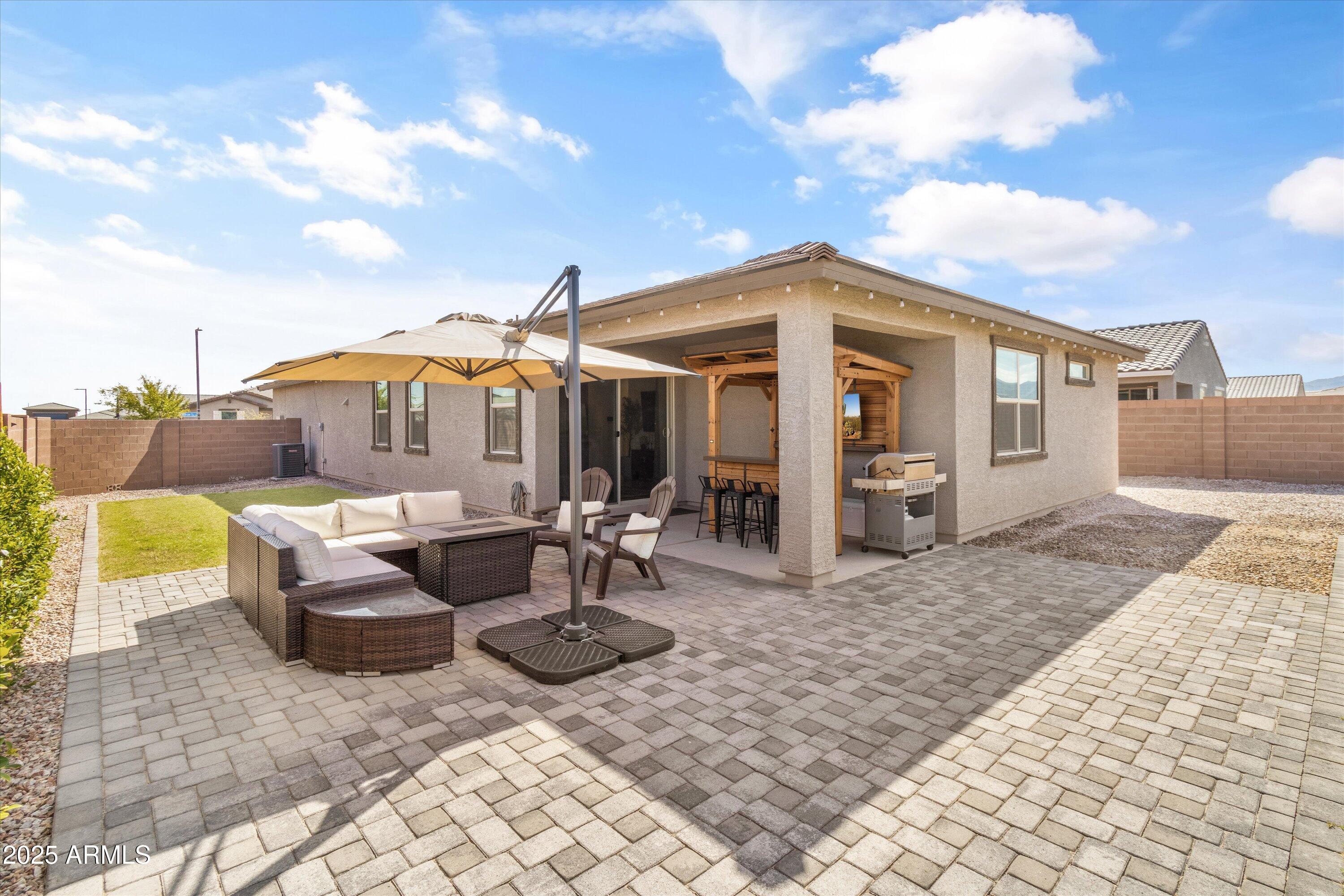 17970 West Pierson Street Goodyear, AZ 85395 - Photo 63 of 66 a front view of a house with patio