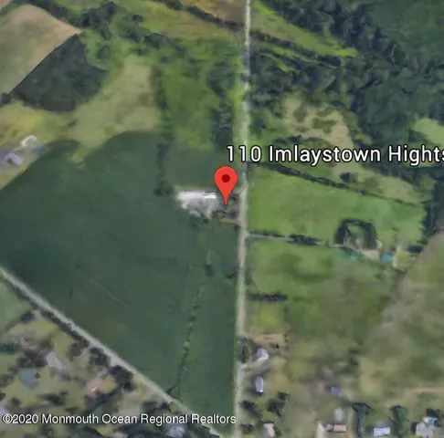 a view of a swimming pool with a yard