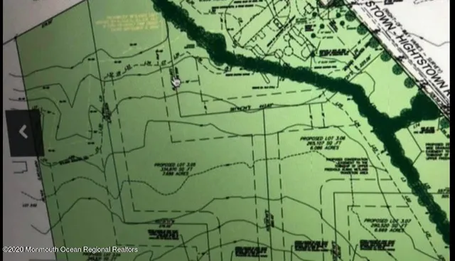 a view of lake with green field