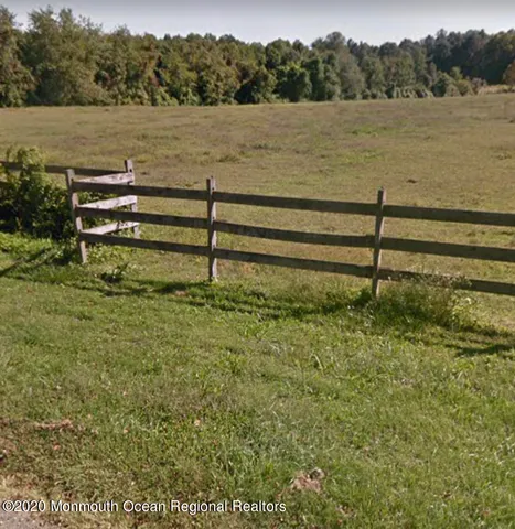 an aerial view of a residential houses with outdoor space