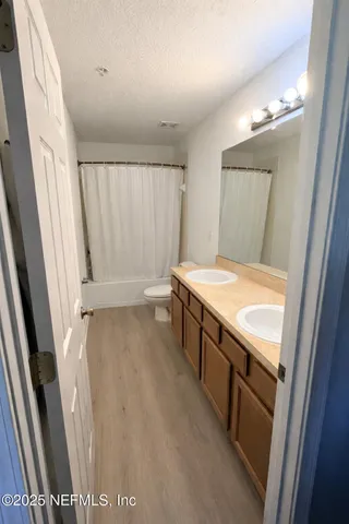 a view of a park with swings and slides