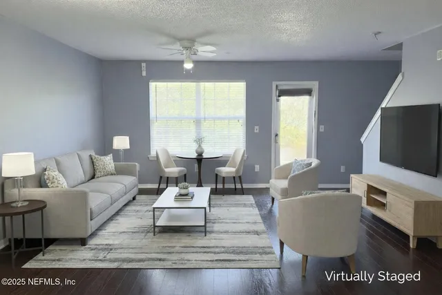 a living room with furniture and a flat screen tv