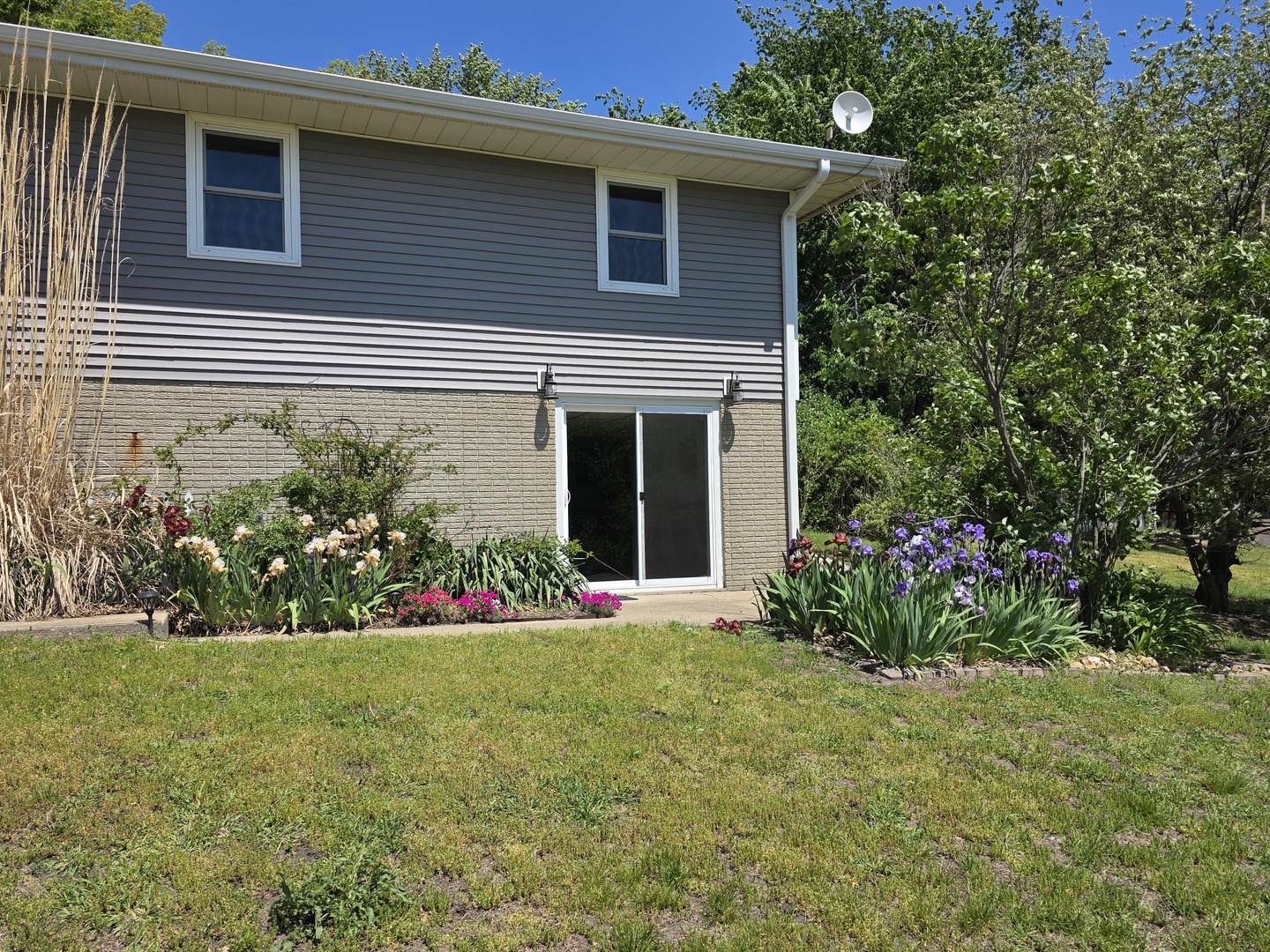 15510 Lomax Road Prophetstown, IL 61277 - Photo 24 of 24 a view of a house with a yard and garden