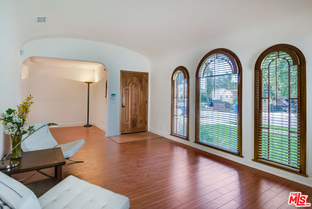 a view of a livingroom with furniture and garden