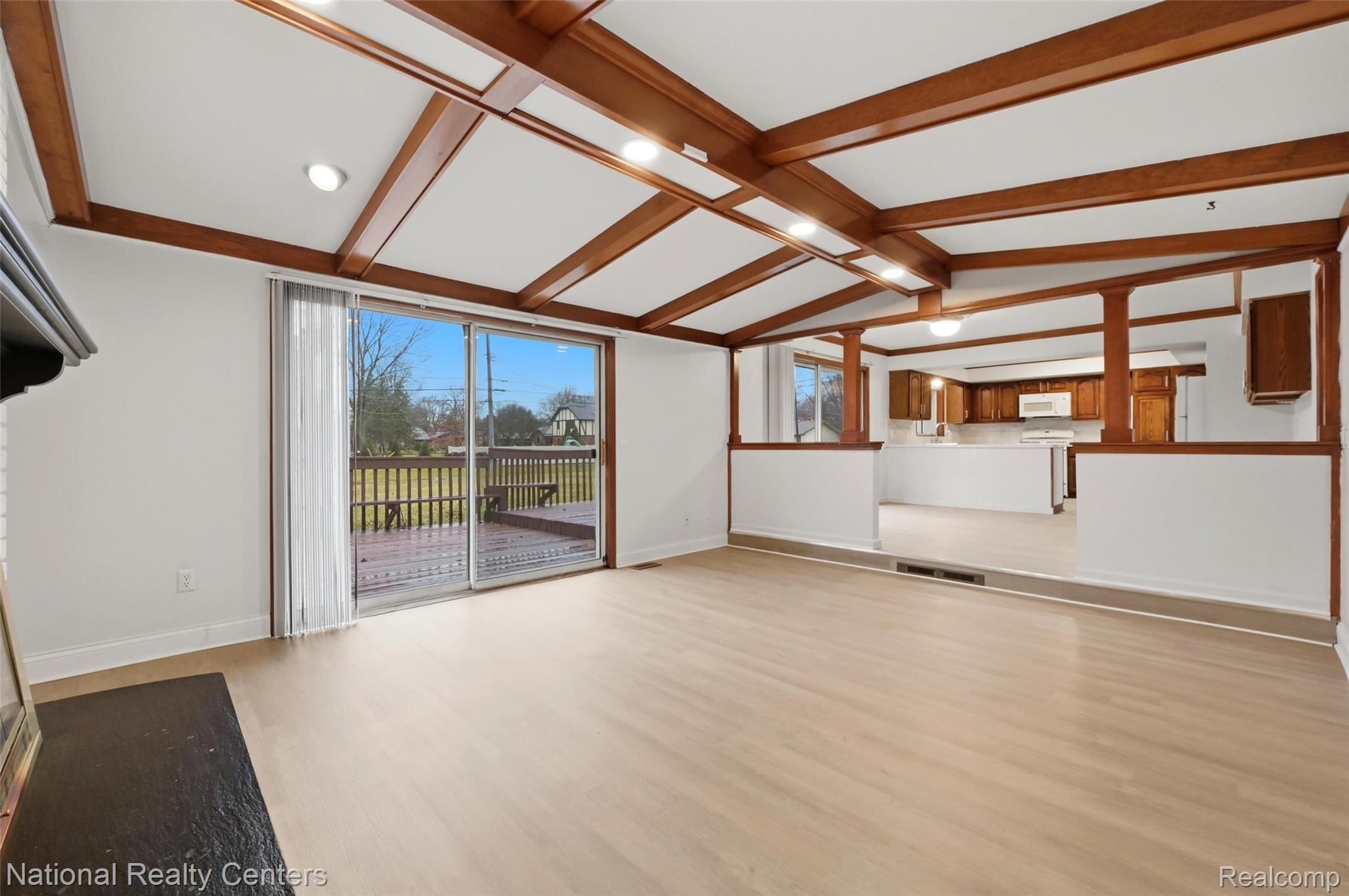 37625 Ryan Road Sterling Heights, MI 48310 - Photo 12 of 30 Unfurnished living room featuring light wood finished floors, lofted ceiling with beams, and recessed lighting