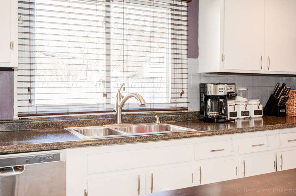 854 Boston Road Billerica, MA 01821 - Photo 13 of 30 a kitchen with granite countertop a sink and a window