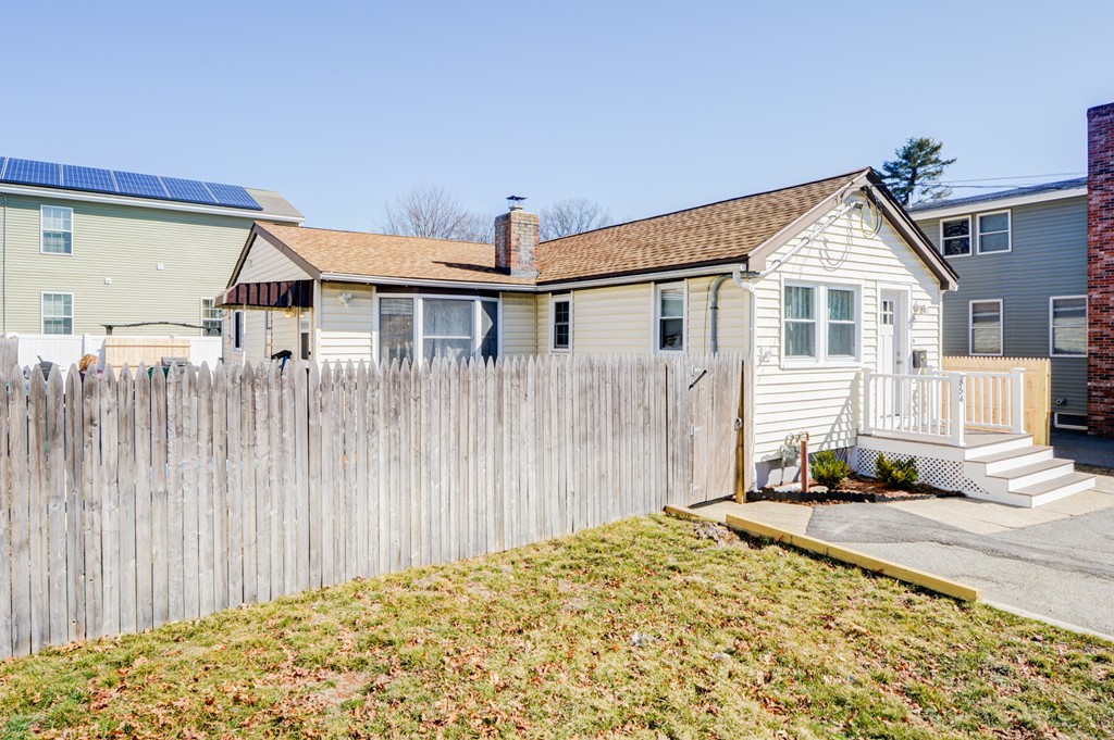 854 Boston Road Billerica, MA 01821 - Photo 2 of 30 a front view of a house with a yard