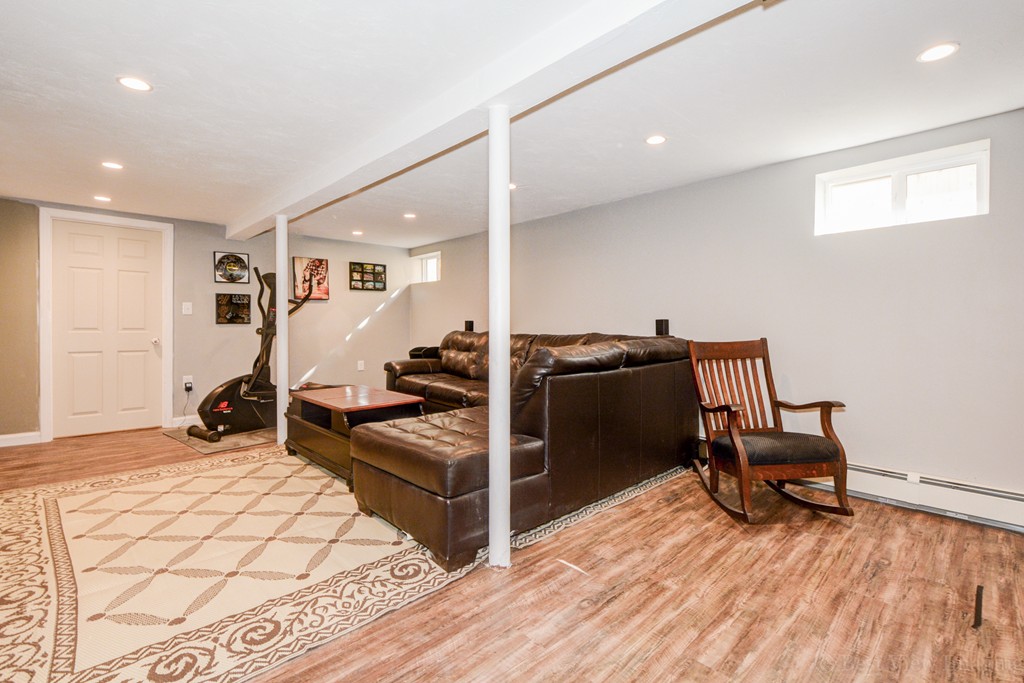 854 Boston Road Billerica, MA 01821 - Photo 24 of 30 a room with gym equipment and wooden floor