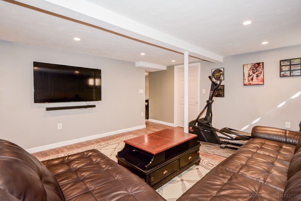 854 Boston Road Billerica, MA 01821 - Photo 25 of 30 a living room with a flat screen tv and a couch