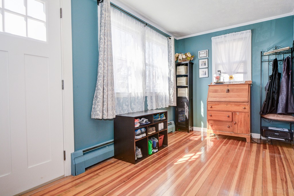 854 Boston Road Billerica, MA 01821 - Photo 4 of 30 a view of a hallway with wooden floor and windows