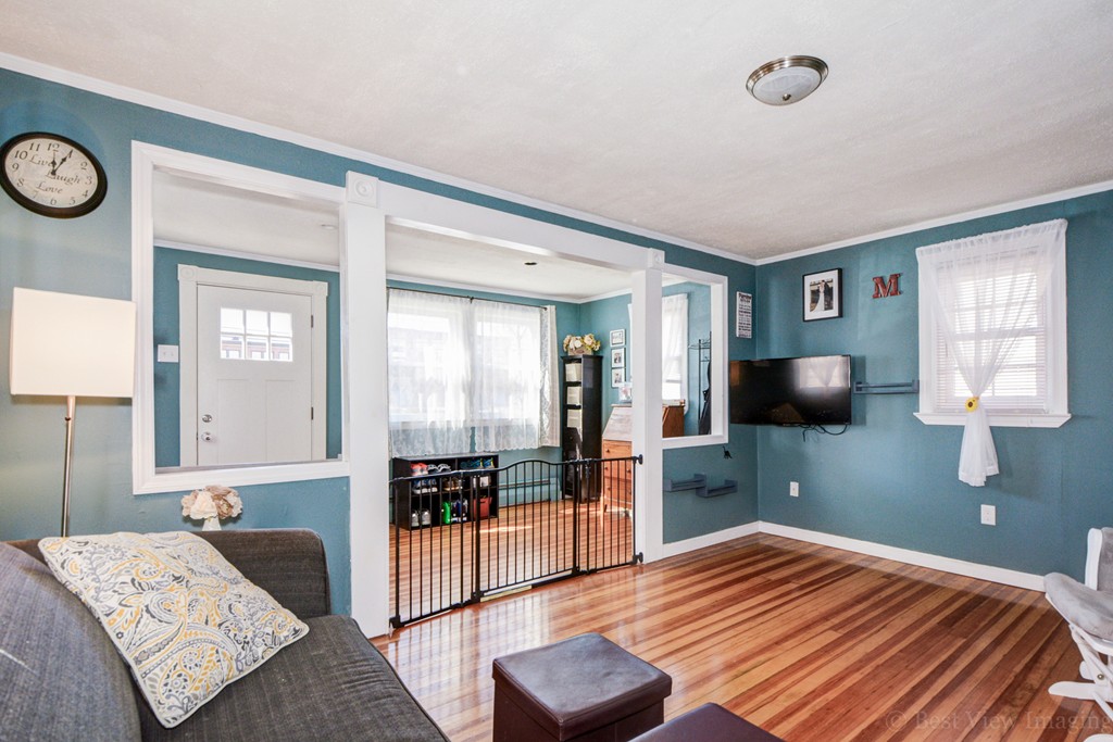 854 Boston Road Billerica, MA 01821 - Photo 7 of 30 a bedroom with a bed and wooden floor