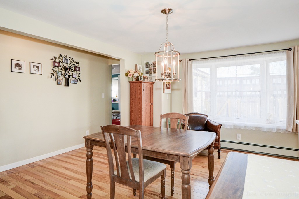 854 Boston Road Billerica, MA 01821 - Photo 9 of 30 a view of a dining room with furniture window and wooden floor