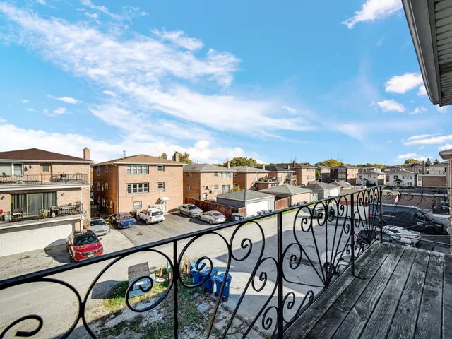 a view of a roof deck with furniture